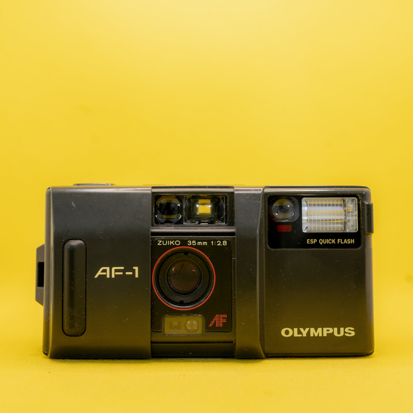 Olympus AF-1 - Fotocamera a pellicola premium 35 mm (Zuiko 2.8) · immagine principale