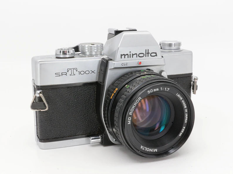Minolta SrT100x - Fotocamera a pellicola 35 mm con 50 mm MD 1.7 | Fotocamera analogica vintage | Minolta · immagine principale
